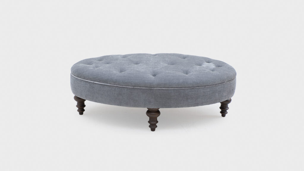 John Sankey Hayworth Oval Footstool in blue fabric with indented top and turned legs - top