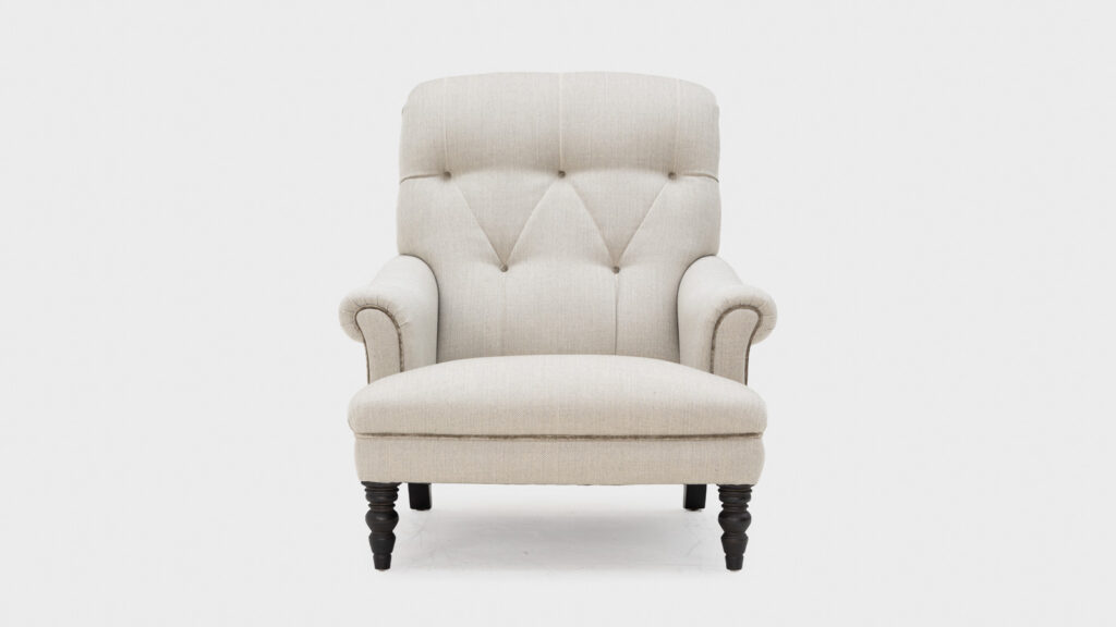 John Sankey Gibson high back armchair with deep buttoning to back piping detail - front