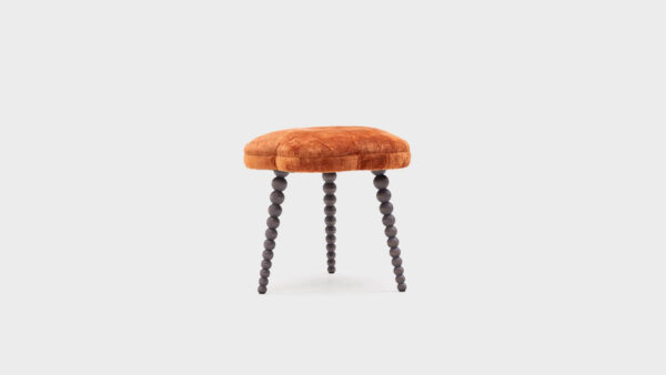 John Sankey Blossom footstool, top is stitched in segments covered in burnt orange viscose velvet with Grey Wash bobbin legs - back