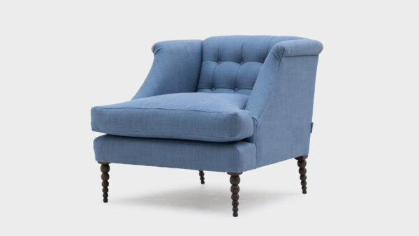 John Sankey blue linen low back boodle chair with bobbin legs and button detail to back - front - angle