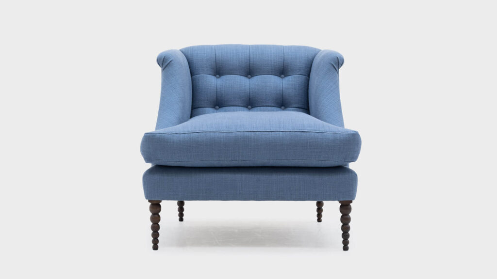 John Sankey blue linen low back boodle chair with bobbin legs and button detail to back - front
