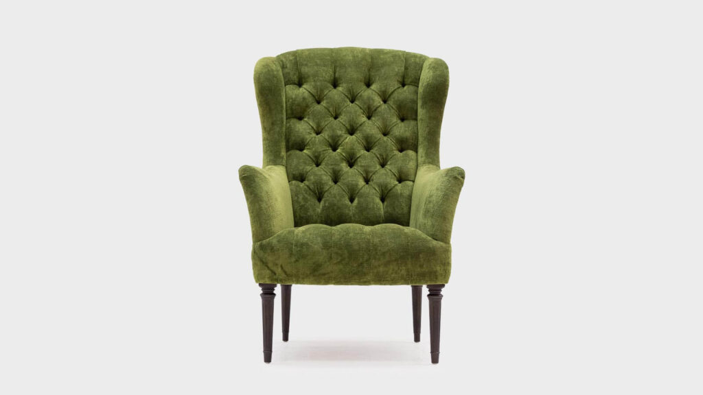 John Sankey Wainwright high backed chair in green velvet with button detail - front